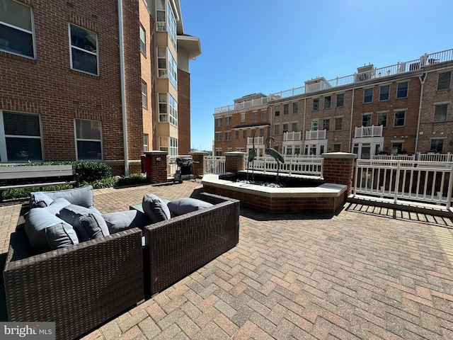 view of patio / terrace featuring an outdoor hangout area and grilling area