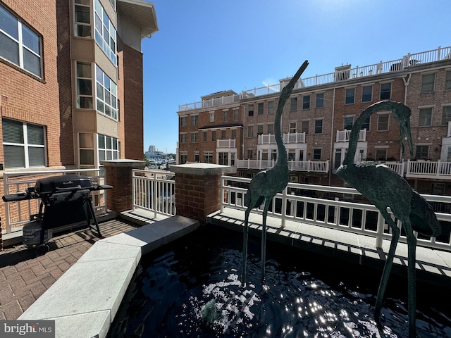 view of dock with a balcony