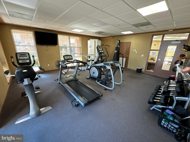 exercise room featuring a drop ceiling