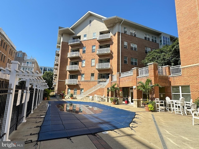 view of pool featuring a patio area