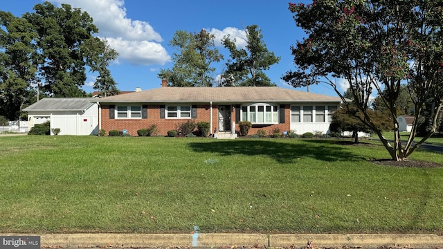 ranch-style home featuring a front lawn