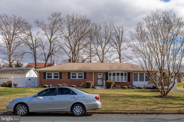 ranch-style house with a front lawn