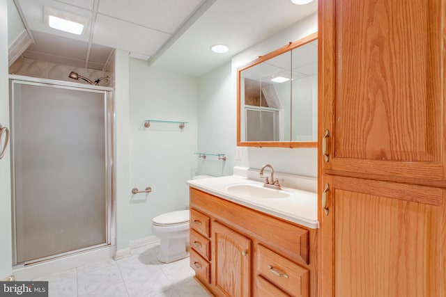 bathroom featuring walk in shower, vanity, and toilet