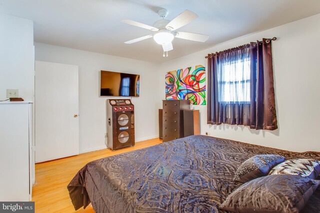 bedroom featuring ceiling fan and hardwood / wood-style floors