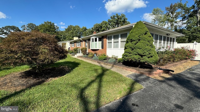 view of home's exterior featuring a lawn