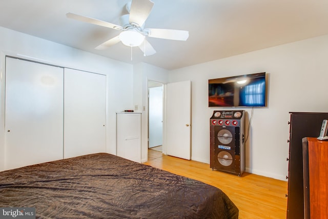 bedroom with a closet, ceiling fan, and hardwood / wood-style floors