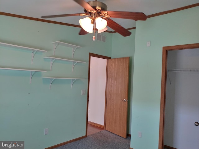 unfurnished bedroom featuring ceiling fan, a closet, and carpet