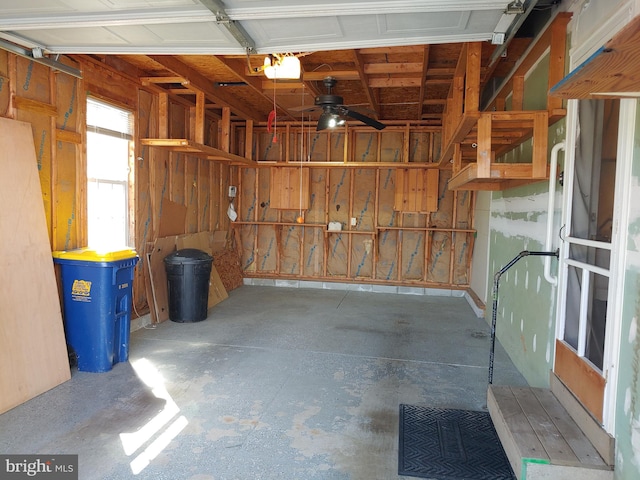 garage featuring ceiling fan and a garage door opener