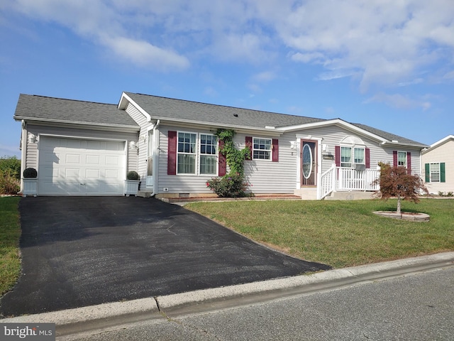 ranch-style home with a front yard and a garage