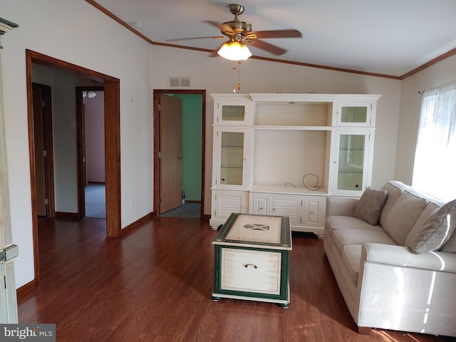 unfurnished living room featuring ceiling fan, dark hardwood / wood-style flooring, and ornamental molding