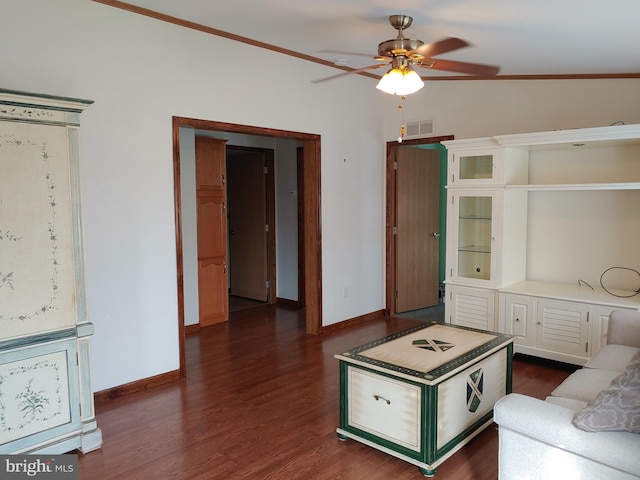 unfurnished living room with ceiling fan, dark hardwood / wood-style flooring, and crown molding