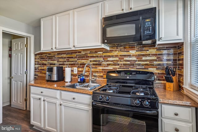 kitchen with black appliances, sink, stone countertops, dark hardwood / wood-style flooring, and white cabinetry