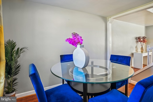 dining space featuring hardwood / wood-style flooring