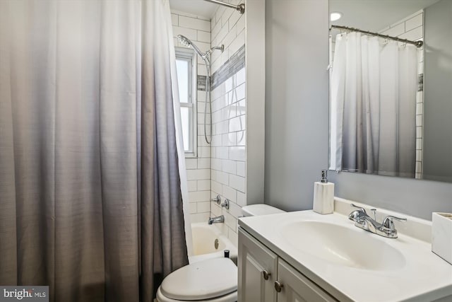 full bathroom featuring vanity, shower / bath combination with curtain, and toilet