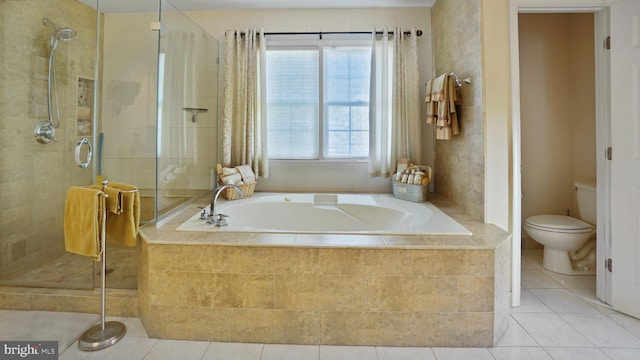 bathroom with toilet, plus walk in shower, and tile patterned flooring