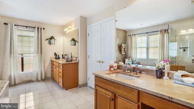 bathroom featuring vanity, independent shower and bath, and tile patterned flooring