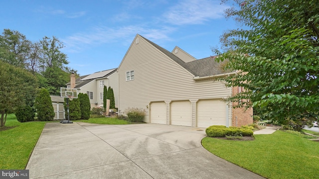 view of property exterior featuring a yard and a garage