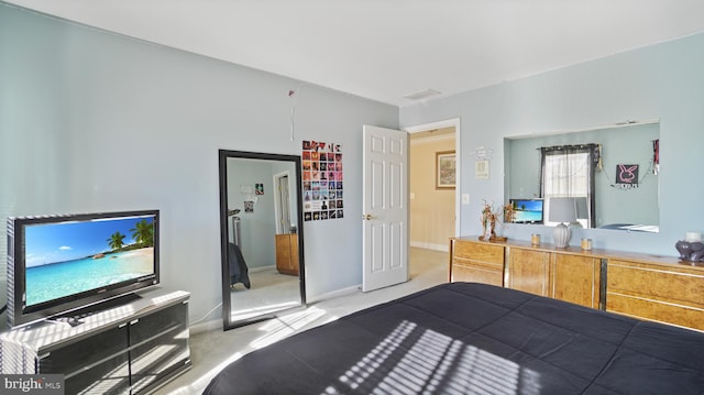 bedroom with light colored carpet