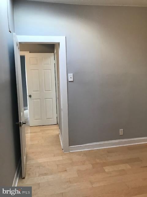 corridor featuring light hardwood / wood-style floors