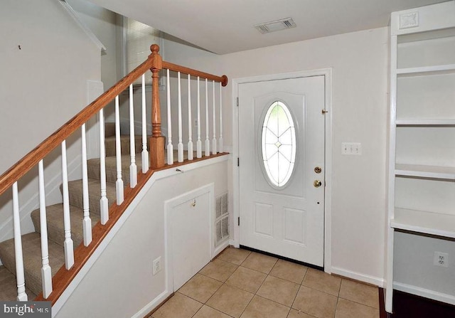 view of tiled foyer entrance