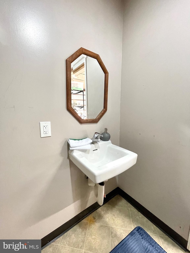 bathroom featuring sink and tile patterned flooring