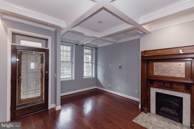 unfurnished living room with beam ceiling, coffered ceiling, and dark wood-type flooring