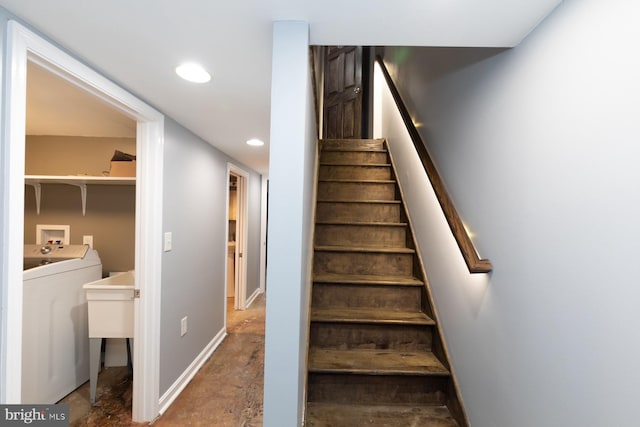 stairs with sink and washer / dryer