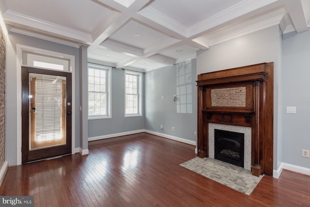 unfurnished living room with a tile fireplace, crown molding, coffered ceiling, beam ceiling, and dark wood-type flooring