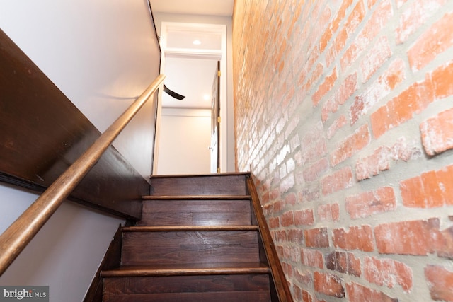 stairway with brick wall