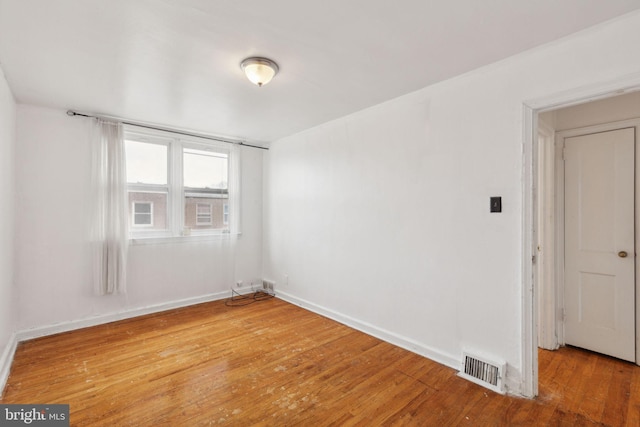 unfurnished room with light hardwood / wood-style flooring