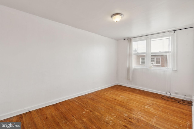 spare room featuring hardwood / wood-style floors