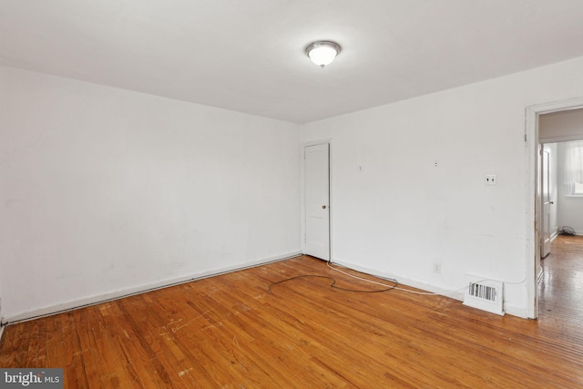 unfurnished room featuring wood-type flooring