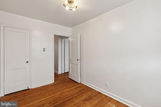 unfurnished bedroom featuring hardwood / wood-style floors