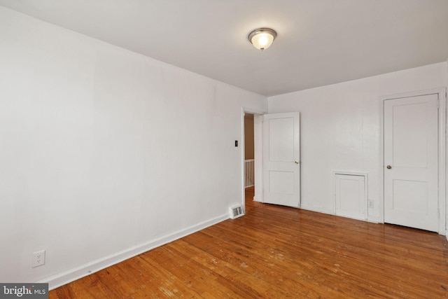 unfurnished bedroom featuring hardwood / wood-style floors