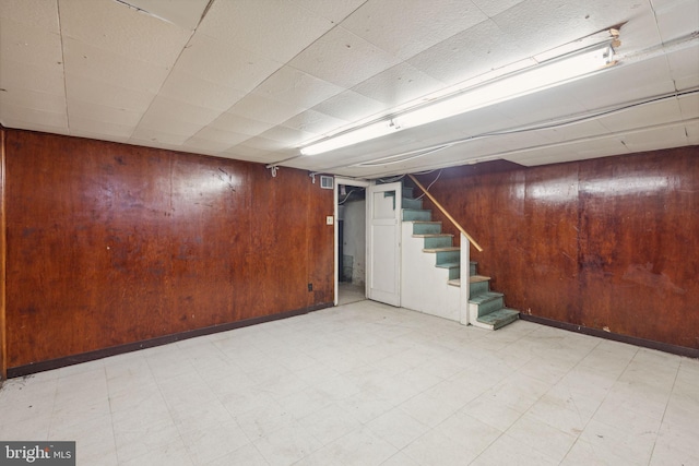 basement with wood walls