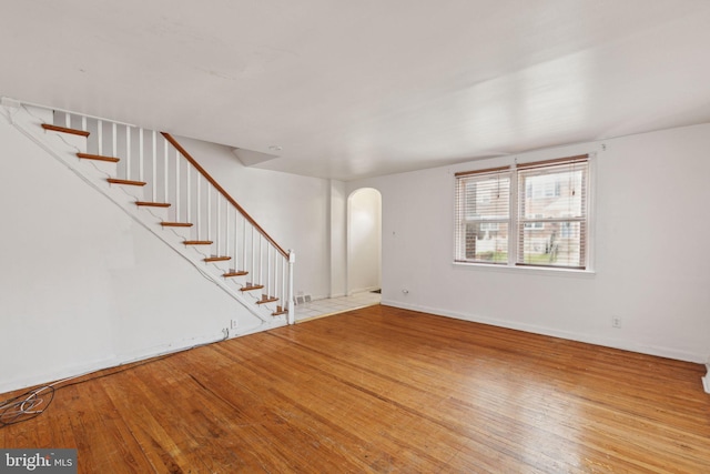 unfurnished living room featuring hardwood / wood-style flooring