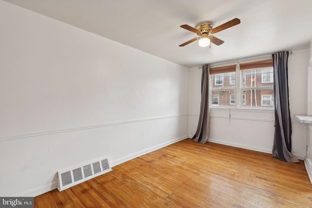 spare room with ceiling fan and light hardwood / wood-style floors