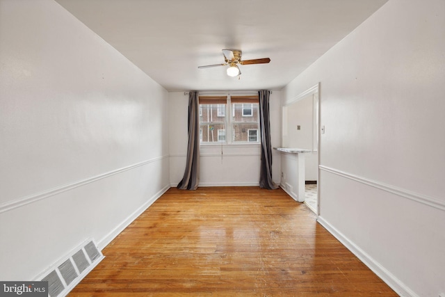 corridor featuring light hardwood / wood-style floors