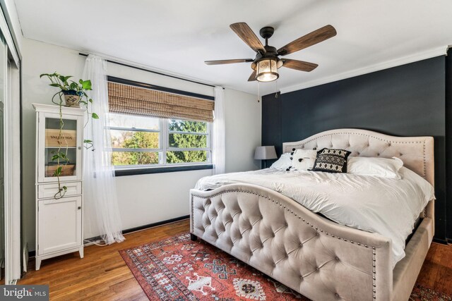 bedroom featuring ceiling fan and hardwood / wood-style flooring