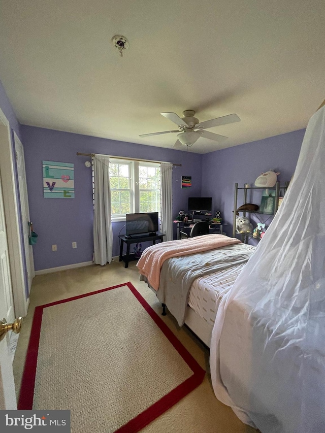 carpeted bedroom featuring ceiling fan