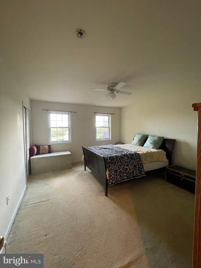 carpeted bedroom with ceiling fan