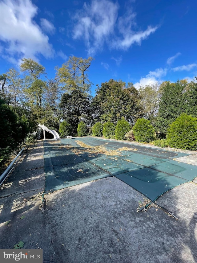 view of pool with a water slide