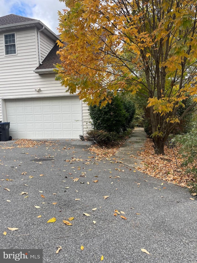 view of side of property featuring a garage