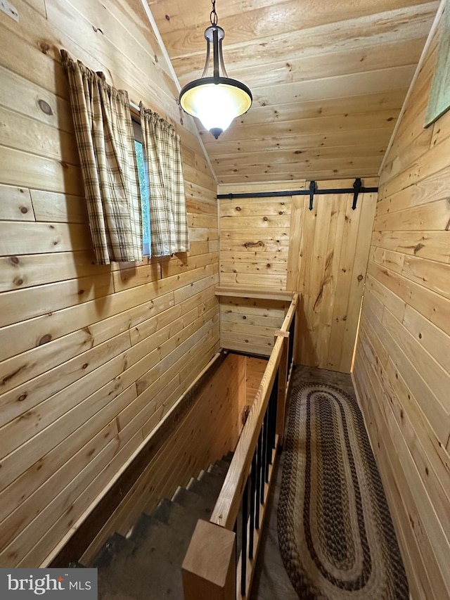 212 Thickhead Rd, Centre Hall, PA 16828 - stairs with lofted ceiling, wooden walls, wooden ceiling, a barn door, and a sauna