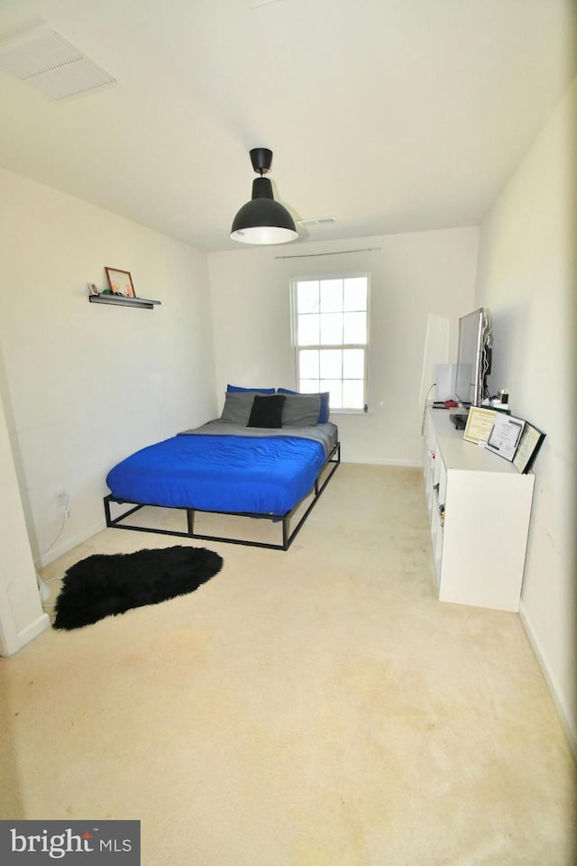 bedroom with light colored carpet