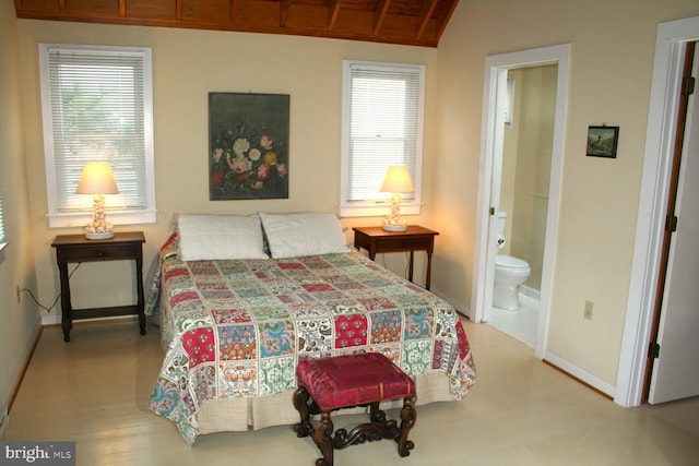 bedroom featuring vaulted ceiling, connected bathroom, and wooden ceiling