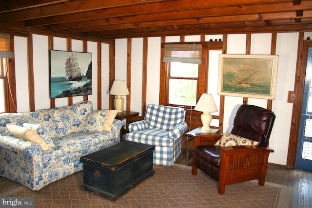 sunroom featuring beamed ceiling