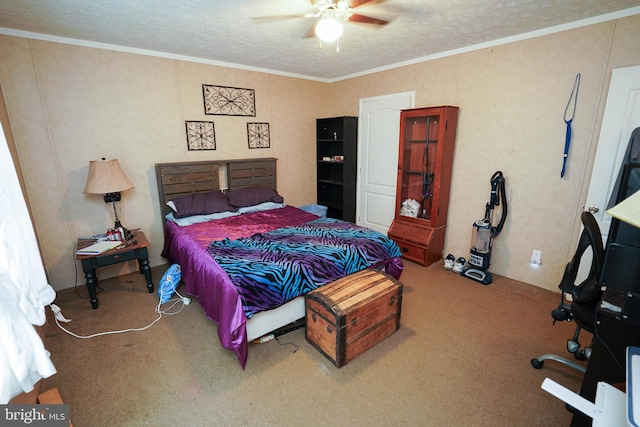 carpeted bedroom with ornamental molding, ceiling fan, and a textured ceiling