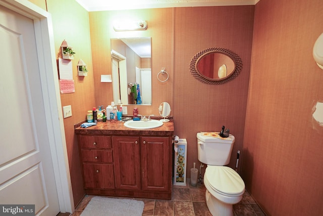 bathroom featuring vanity and toilet