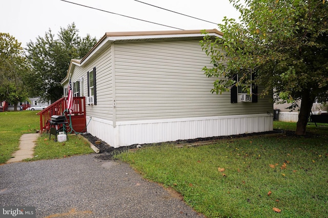 view of home's exterior featuring a lawn